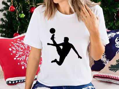 Silhouette of a soccer player kicking a ball in mid air motion with dynamic movement