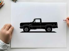 Silhouette of a classic pickup truck in profile view