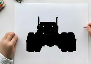 Silhouette of a large truck with oversized tires and exhaust pipes