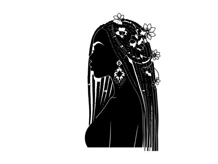 Silhouette of a woman wearing a beaded headdress