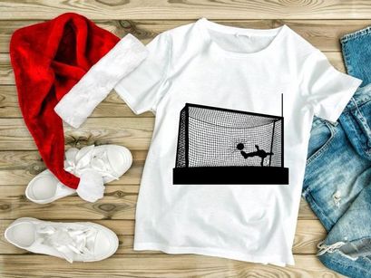 Soccer goalkeeper diving to block a shot on goal in a soccer match