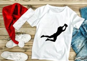 A silhouette of a person jumping up to catch a ball in mid air motion dynamically