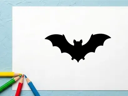 Silhouette of a Bat in Flight for Halloween or Nighttime Themes