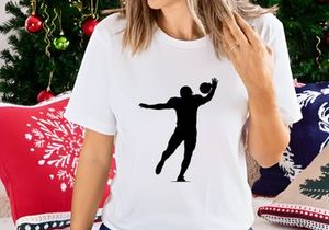 A silhouette of a person playing volleyball with a ball in mid air action