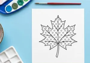 Polka dot maple leaf illustration. Decorative autumn foliage icon with stitched pattern.