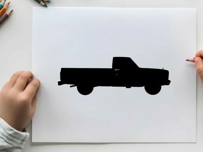Silhouette of a classic pickup truck against a white background