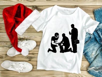 American football player receiving medical attention on the field from trainer