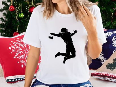 A person jumping in the air with arms outstretched in a dynamic pose