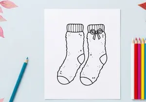 Kaos kaus Natal bergambar tangan dengan hiasan pita hadiah terisolasi di latar belakang putih