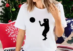 A silhouette of a person catching a ball in mid air with athletic movement and focus