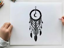 Silhouette dreamcatcher with crescent moon and feathers