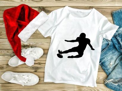 Rugby player kicking ball in mid action dynamic movement