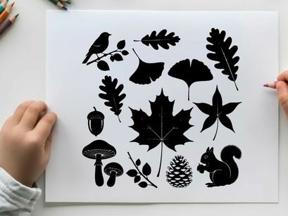 Silhouette of forest elements including leaves acorns and animals