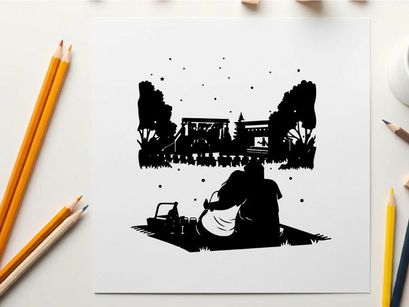 Silhouette of a couple watching a movie outdoors at night