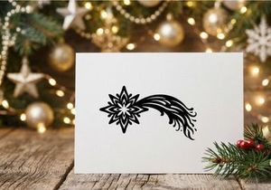 Black and white Christmas star icon with a flowing comet tail design element.