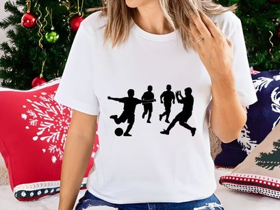 Silhouette of soccer players in action kicking and running with ball