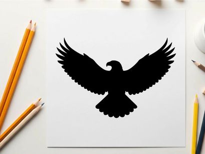 Black silhouette of an eagle in flight with wings spread wide