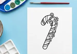 Candy cane ornament line art drawing for Christmas holiday coloring book page design.