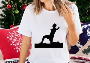 A silhouette of a man in a dynamic yoga pose outdoors