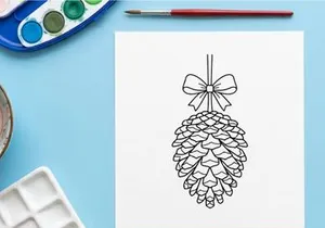Decorative pine cone ornament hanging from a string. Festive holiday decor for Christmas and winter celebrations.
