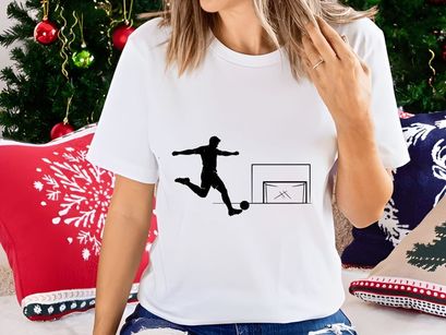 Soccer player kicking ball into goal in a dynamic motion