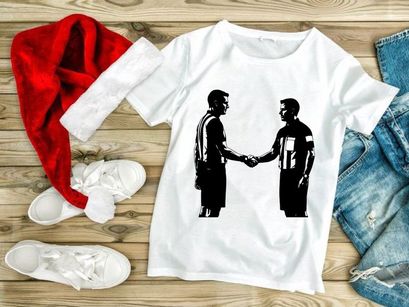 Two referees shaking hands in a show of sportsmanship and respect