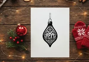 Elegant Christmas ornament with intricate black and white design