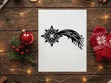 Black and white Christmas star icon with a flowing comet tail design element.