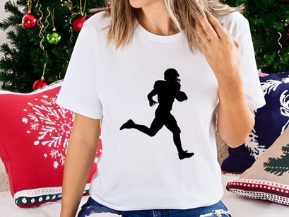 American football player running with ball in hand silhouette
