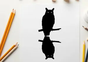 Silhouette of an owl perched on a branch with reflection