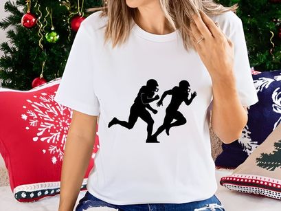 Two american football players running side by side in black silhouette