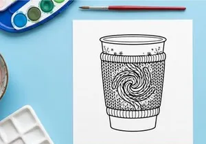 Christmas coffee cup coloring page with knitted cozy sleeve and snowflake pattern design