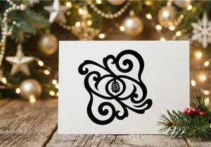 Black pine cone silhouette with elegant floral scrollwork and decorative swirl ornament
