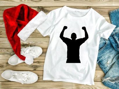 A triumphant man standing with arms raised in victory and celebration