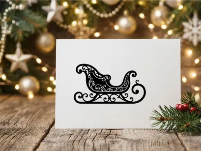 Black silhouette of a decorative Christmas sleigh isolated on a white background