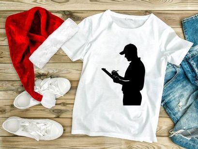 Silhouette of a man in a cap reading a document or writing