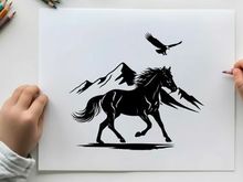 Silhouette of a horse and eagle in mountainous terrain silhouette