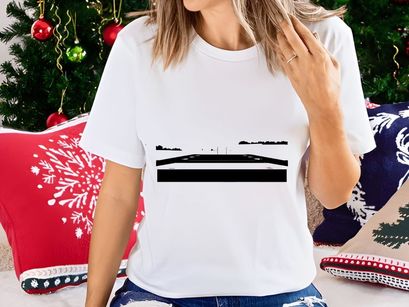 A black and white landscape photograph of a road with trees in the distance