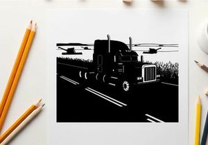 Silhouette of a semi truck driving on a rural highway at dusk
