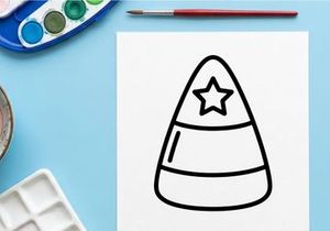 Candy corn icon with star. Halloween sweet treat graphic design element.