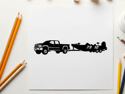 Silhouette of a pickup truck towing a racing boat