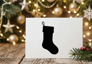 Black Christmas stocking silhouette isolated on white background for holiday design.