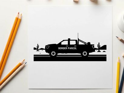 Silhouette of a pickup truck in the desert with cacti