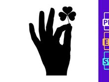 Hand holding four leaf clover shadow luck symbol success