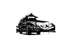 Silhouette of a car with a roof tent and awning in a mountainous landscape