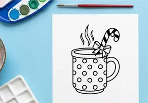 Steaming hot coffee mug with candy cane and snowflake for festive Christmas morning