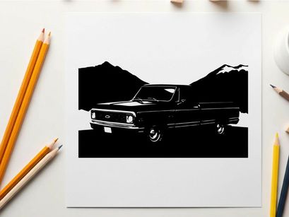 Silhouette of a classic pickup truck in front of mountains