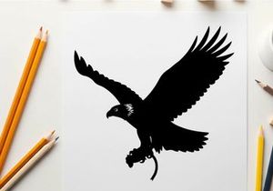 Silhouette of an eagle in flight with outstretched wings and talons