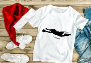 A black silhouette of a person diving to catch a ball in mid air motion quickly