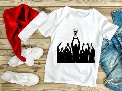 Silhouette of a group celebrating with a trophy